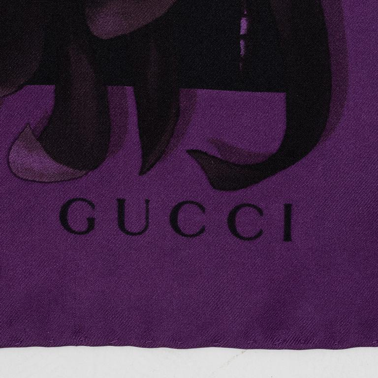 Gucci, a silk scarf.