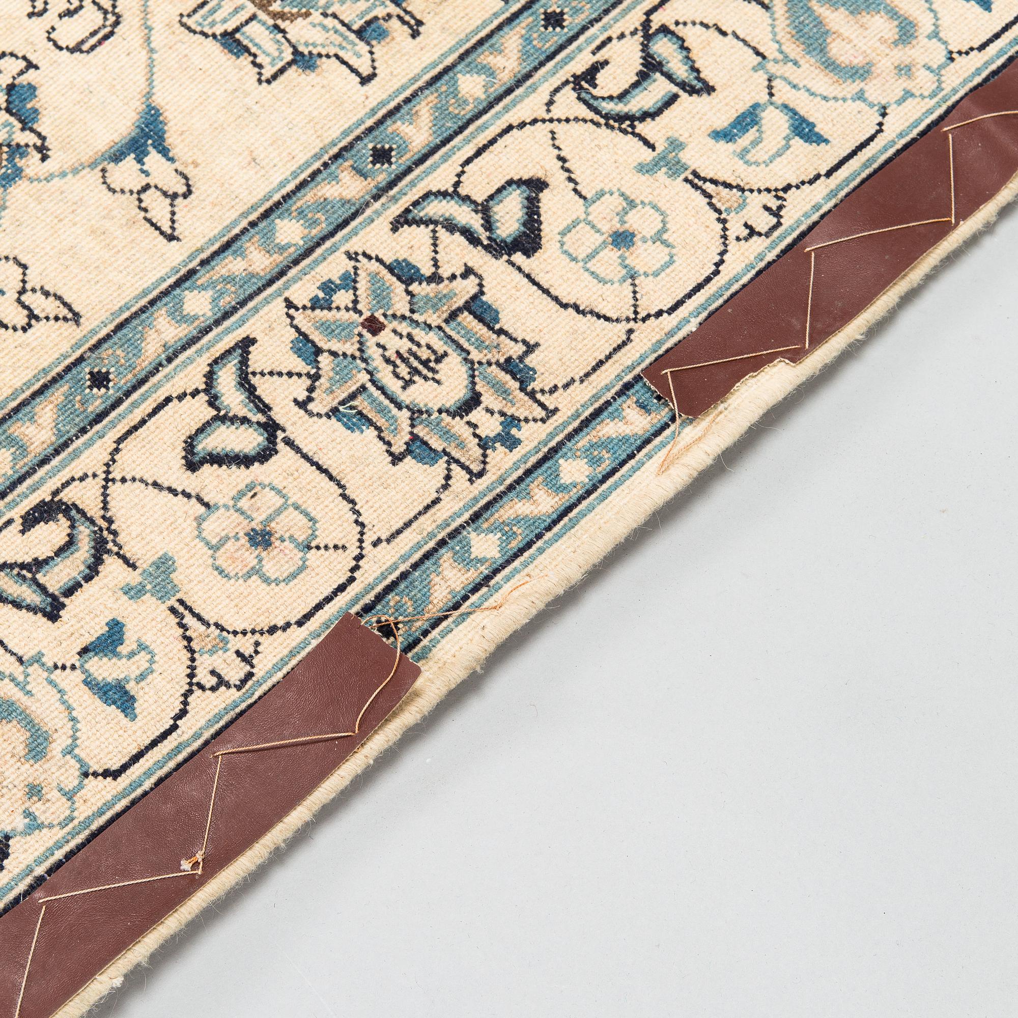 A carpet, Nain Part Silk. Ca 185 x 123 cm.