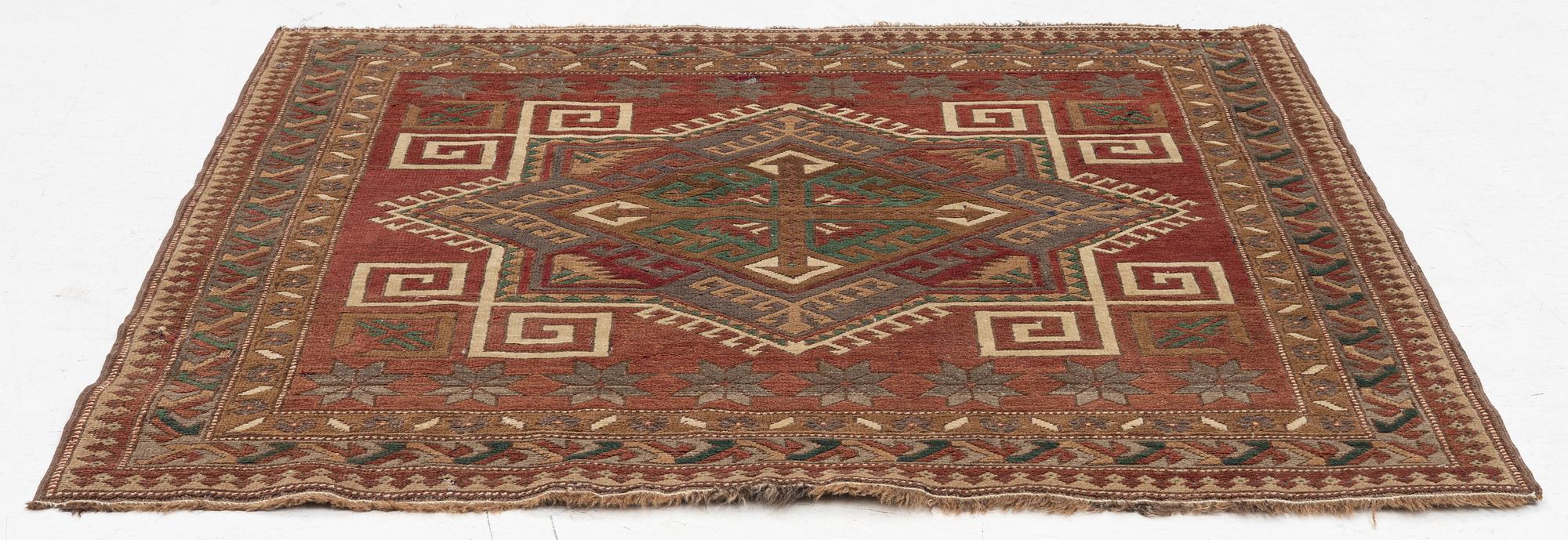 A Kazak rug, semi-antique, c. 137 x 148 cm.