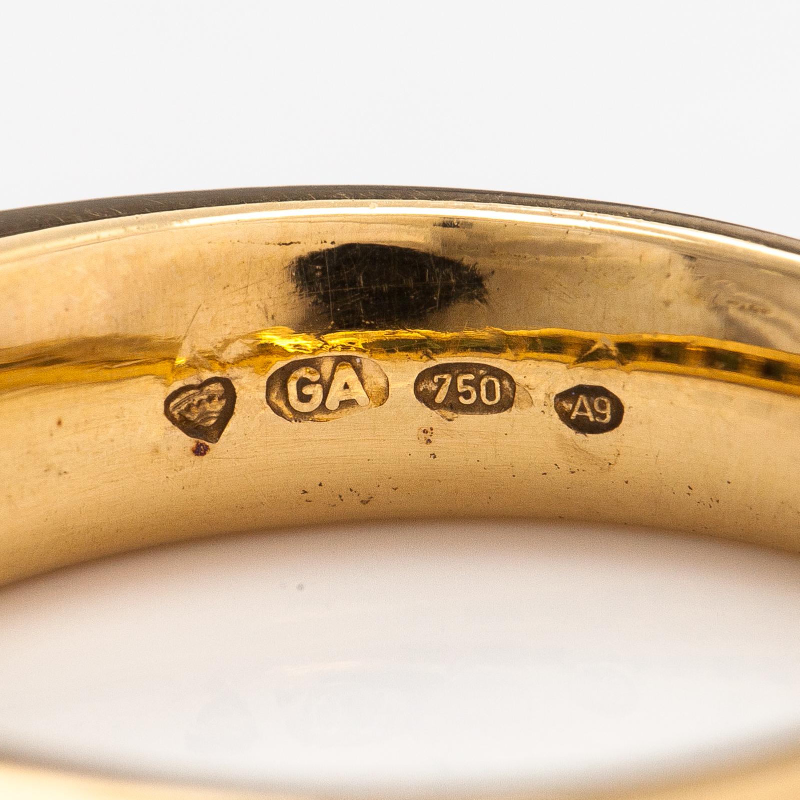 An 18K gold ring with tourmalines. Finland 2002.