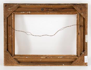 A wood frame with decorations of oak leaves. Circa 1900.