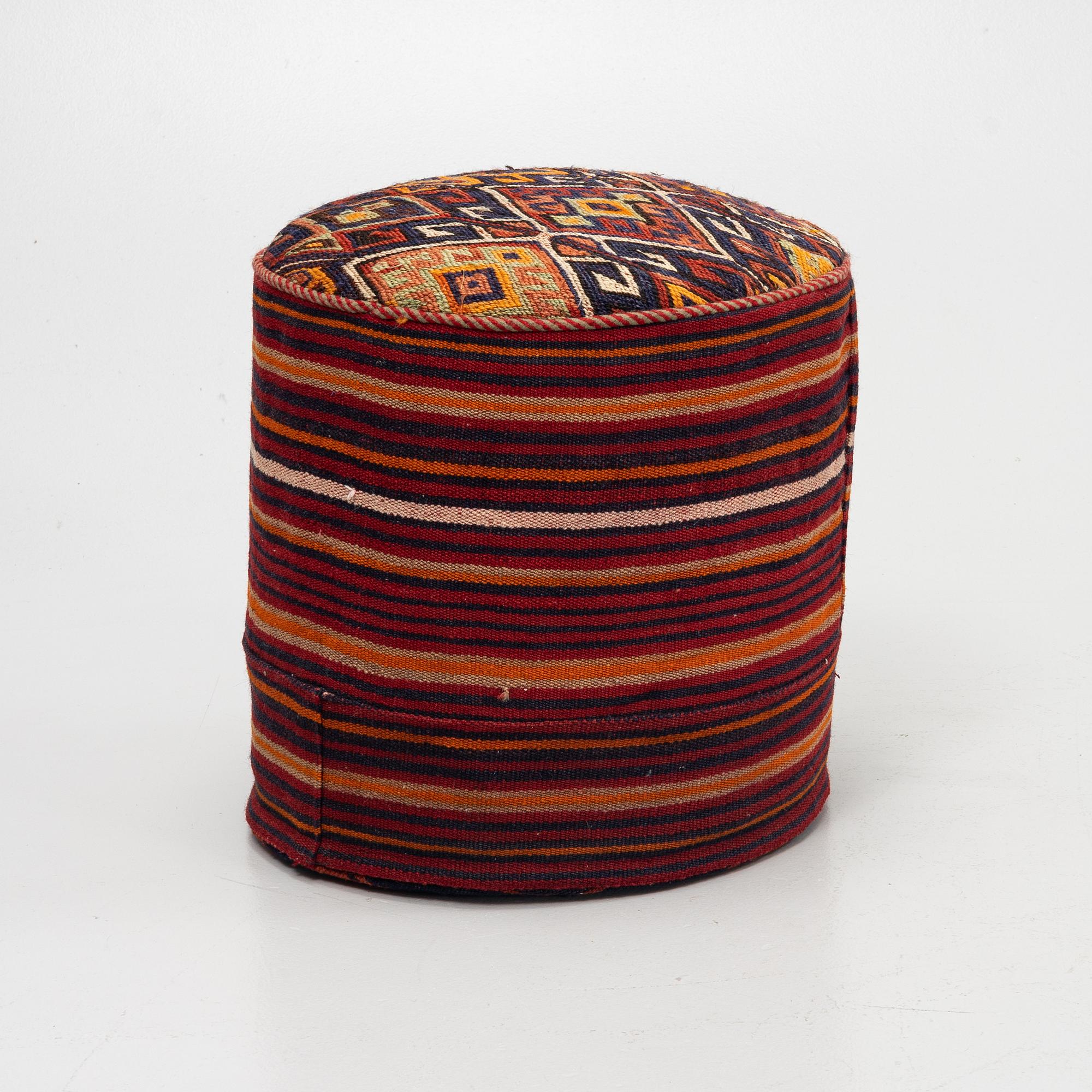 A Kelim covered stool.