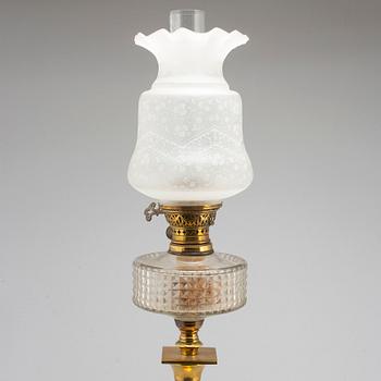 A brass oil lamp, late 19th Century.