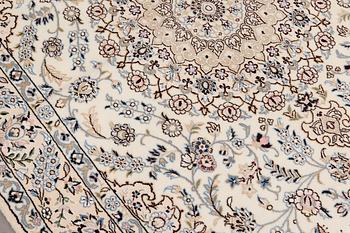 A Nain part silk carpet, 254 x 156 cm.