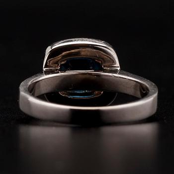 RING, vitguld 14K, fasettslipad safir 1,51 ct, briljantslipade diamanter tot. 0,58 ct. Vikt 5,3 g.