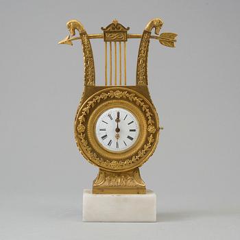 A TABLE CLOCK, empire, early 19th century.