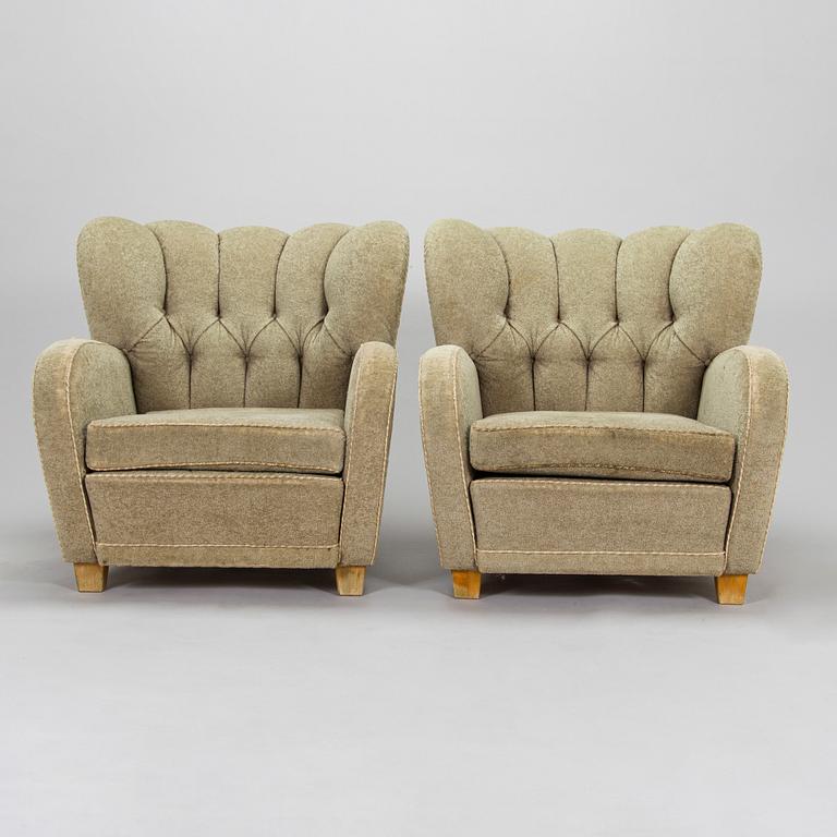 A pair of mid-20th century armchairs.