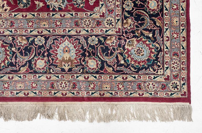 An oriental carpet, a. 378 x 278 cm.