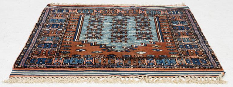 A semi-antique Anatolian rug, c. 127 x 117 cm.