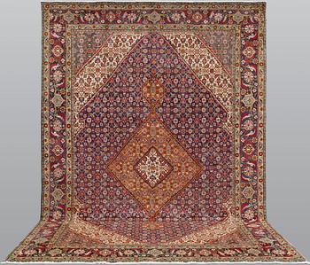 A Tabriz carpet, approximately 360 x 255 cm.