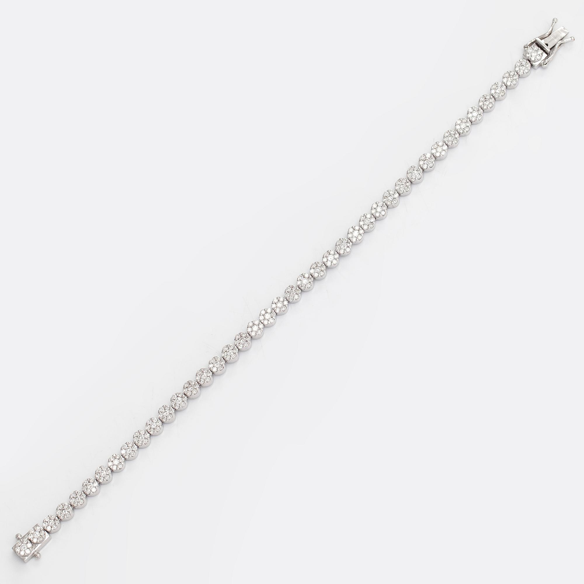 Tennisrannekoru, 18K valkokultaa, timantteja yht noin 3.44 ct. Suomalaiset leimat.