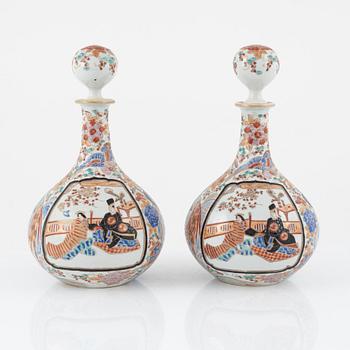 A set of Japanese porcelain bottles with stoppers, early 20th century.