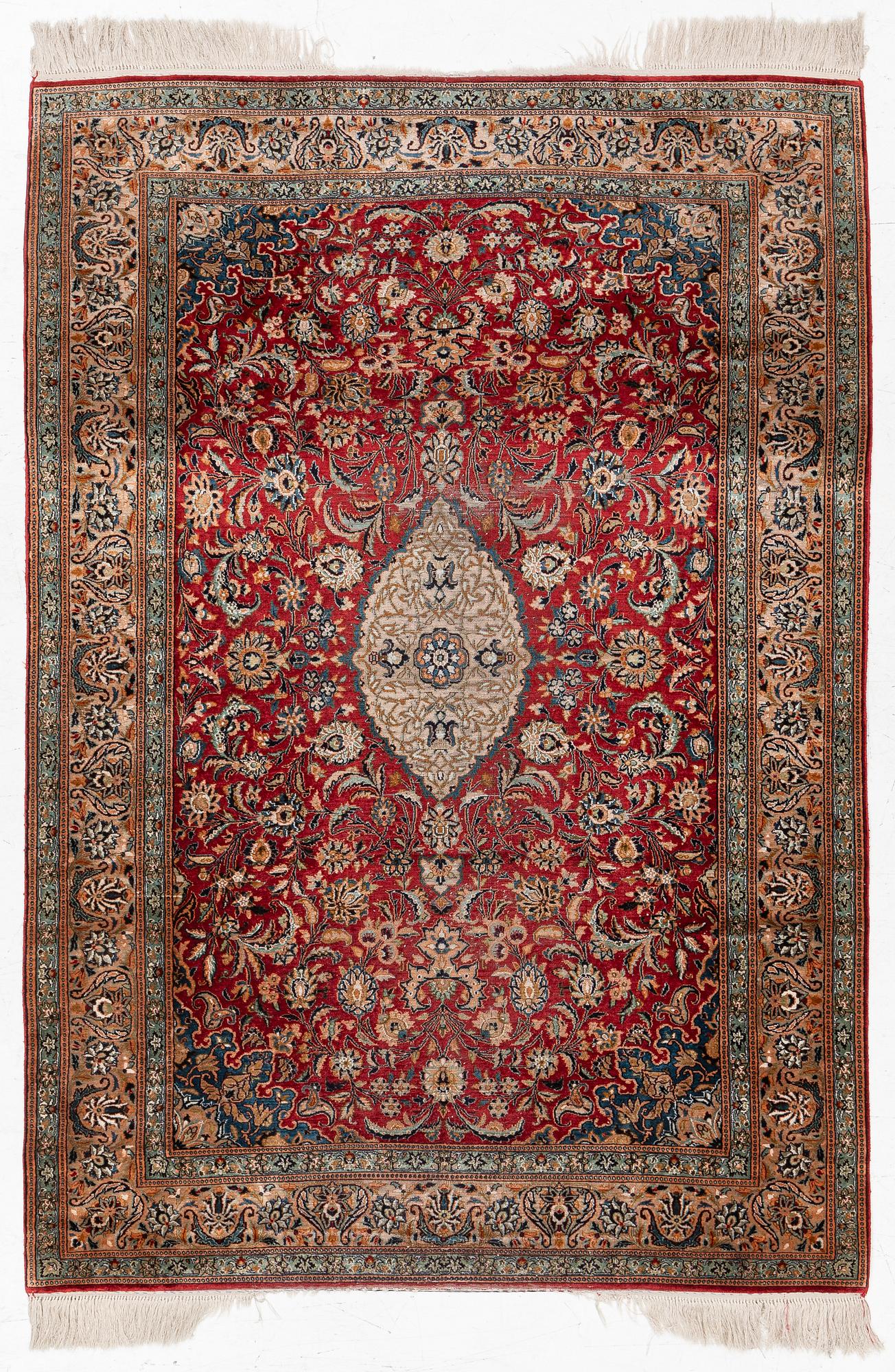 A silk Kashmir rug, c. 176 x 121 cm.