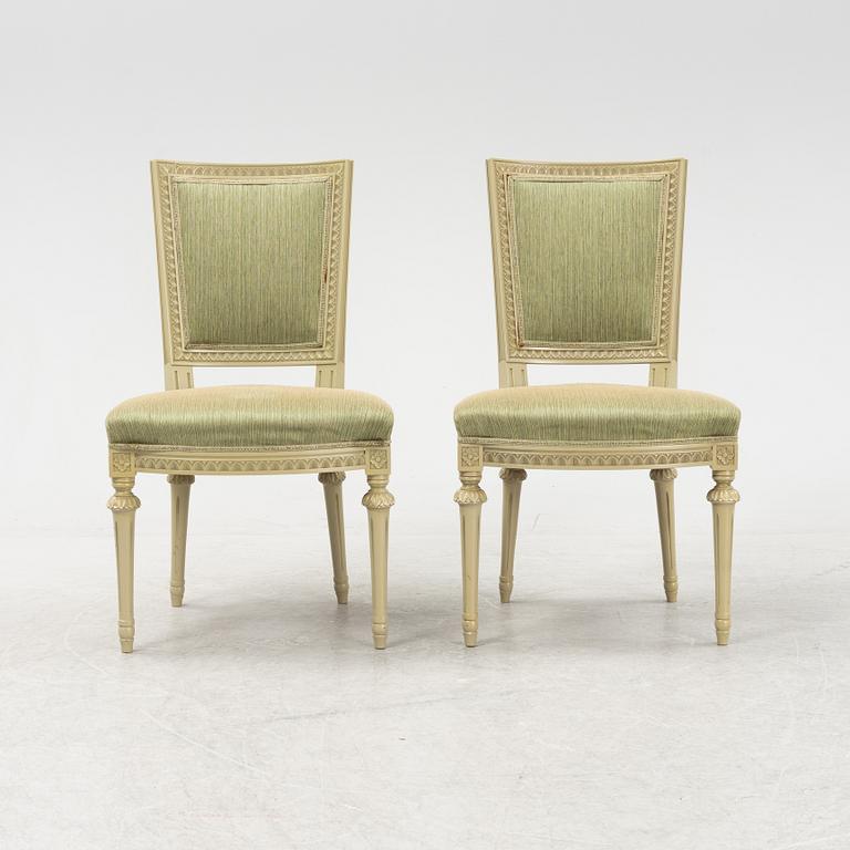 A Gustavian dining table with six chairs. Åmells dated 1974.