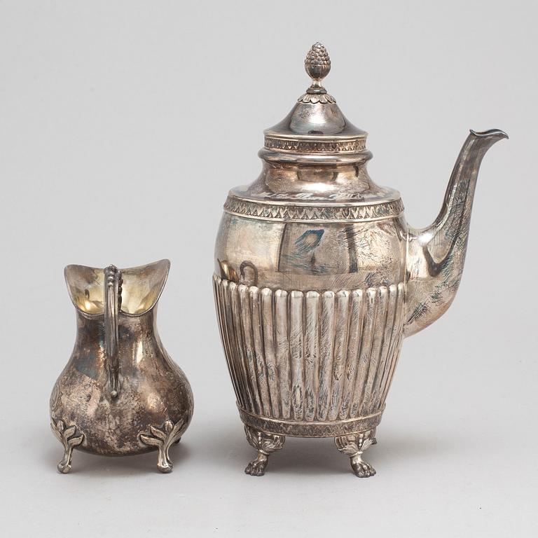 A silver coffee pot and creamer, Stockholm, 1875-1917.