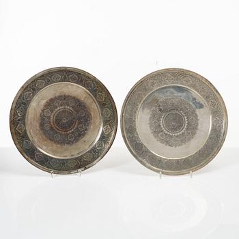 A pair of Persian silver plates, 20th century.
