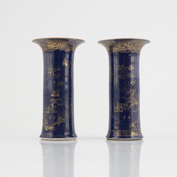 A pair of powder blue and gold 'trumpet' vases, Qing dynasty, 18th century.