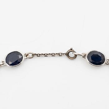 18K white gold necklace with dark sapphires.
