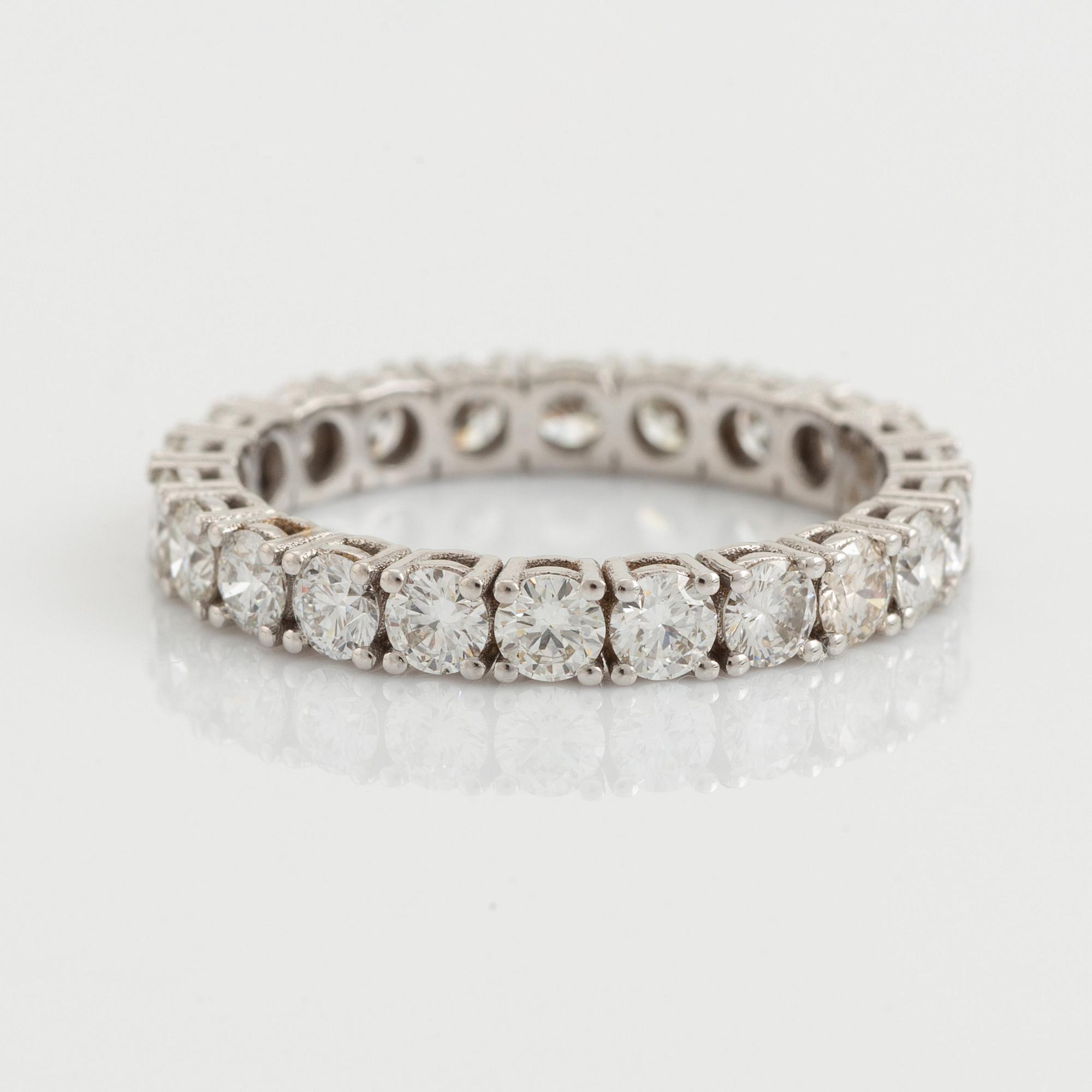 Brilliant cut diamond eternity ring.