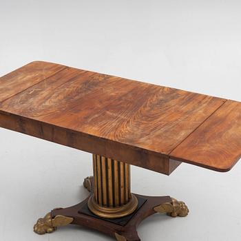 An Empire table, first half of the 19th Century.