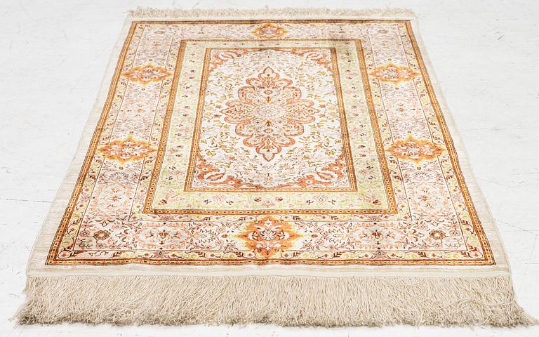 A Hereke silk rug, West Anatolia, c. 107 x 69 cm.