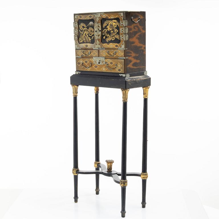 A maki-e cabinet on stand, Japan, 19th century.