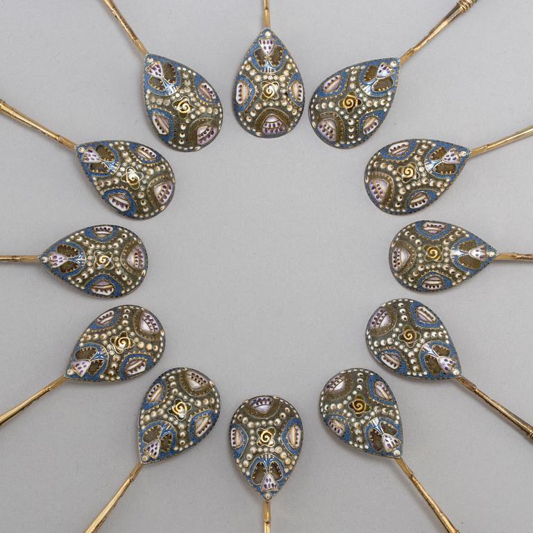 A set of twelve Fabergé silver-gilt and cloisonné enamel tea-spoons small, work master Fedor Rückert, Moscow 1908-1917.
