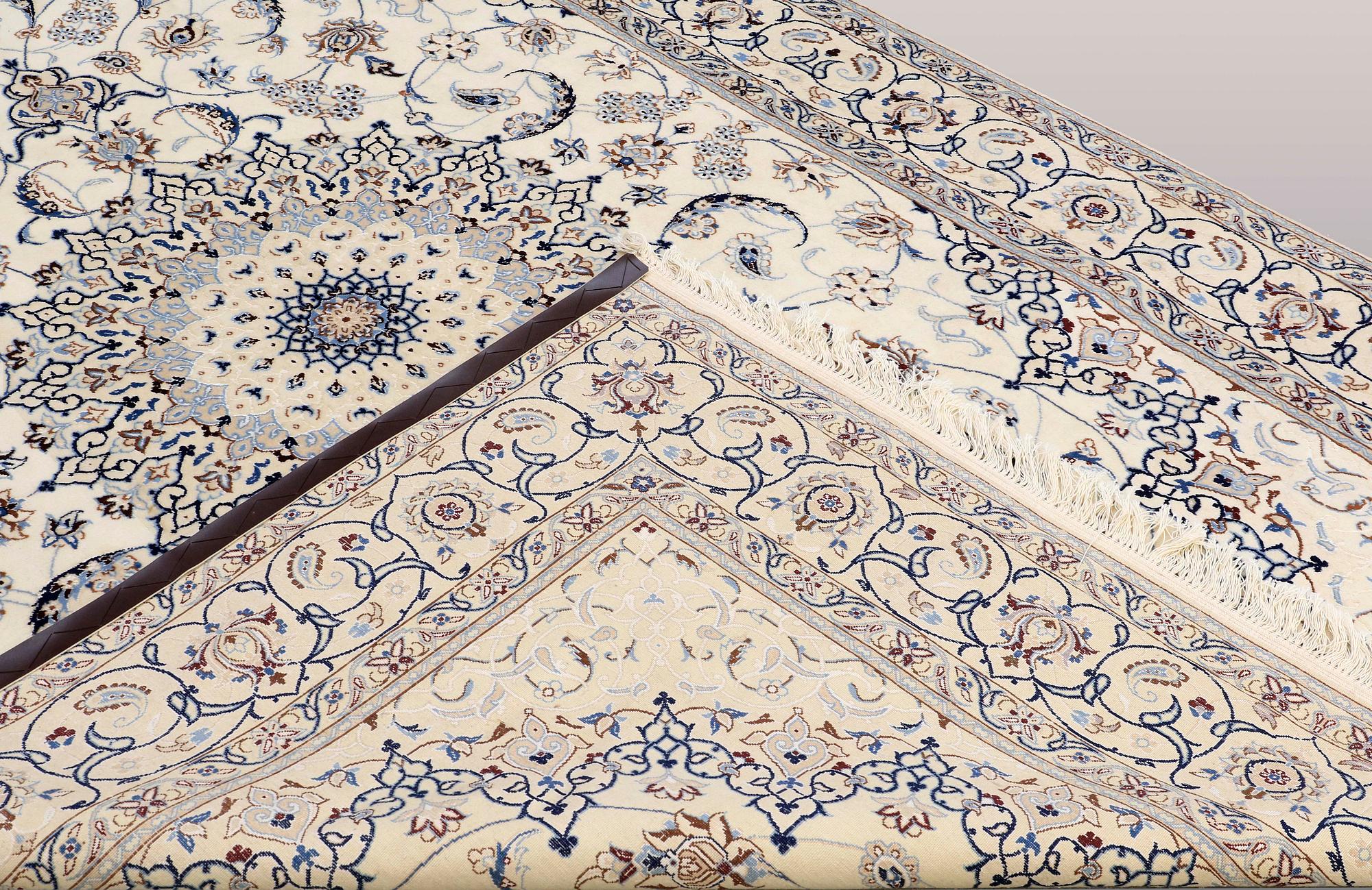 A CARPET, Nain part silk, s.k 9LAA, ca  303 x 202 cm.