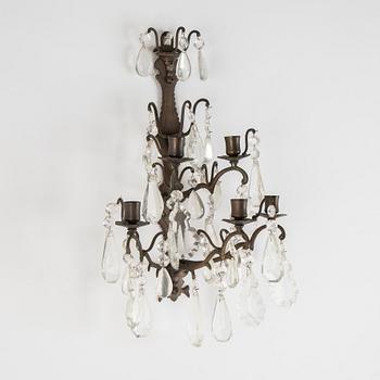 A pair of brass and cut glass five-light  baroque-style wall lights.