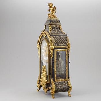 A boulle style table clock, circa 1900.