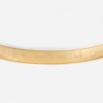 Cartier armband 18K guld med en rund briljantslipad  diamant "Anniversary Bracelet".