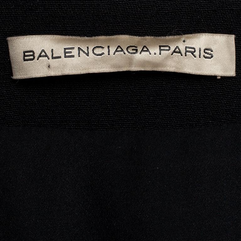 BALENCIAGA, a black wool blend and silk skirt.