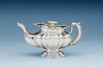 1275. A RUSSIAN PARCEL-GILT TEA-POT, makers mark of Adolf Sper, St. Petersburg 1842.