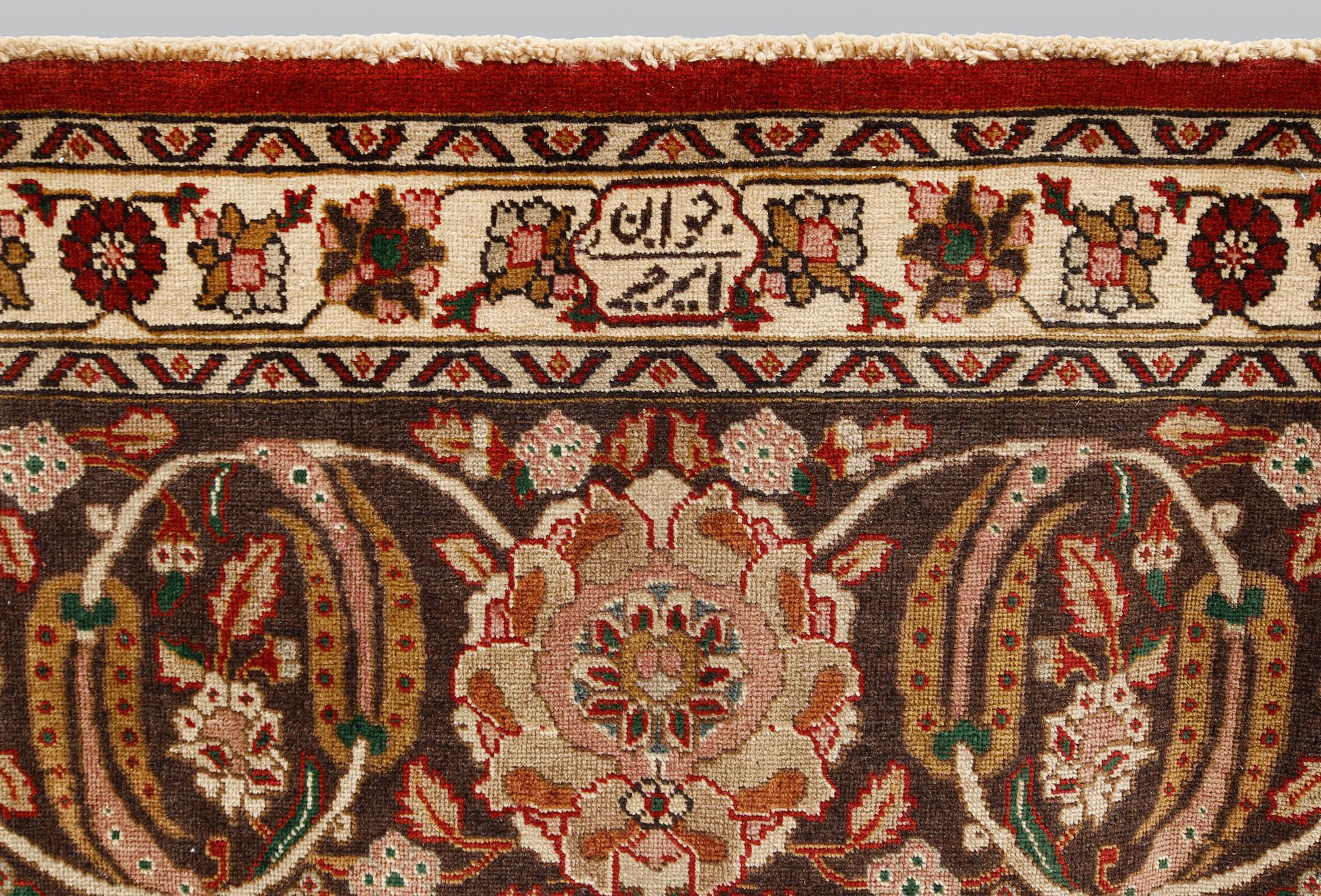 A Tabriz carpet signed Amirkhiz, ca 485 x 343 cm.
