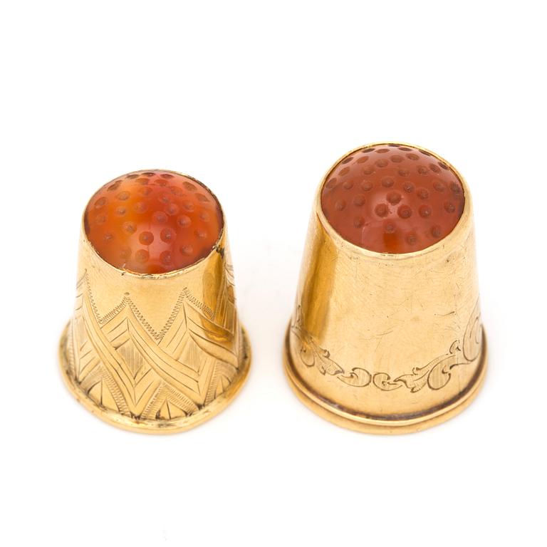 Two18K gold thimbles with carnelian.