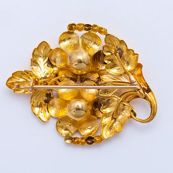 A gold brooch.