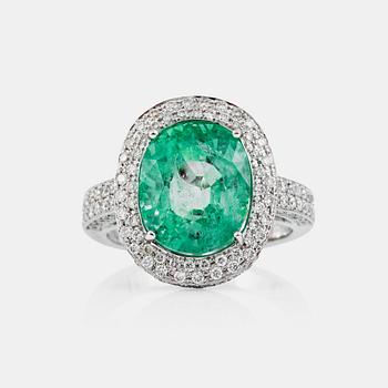 760. A green beryl, circa 6.00 cts, and diamond, circa 1.30 cts, ring.