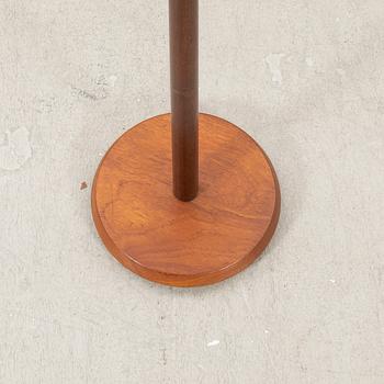 A mid 20th century teak and brass floor lamp.