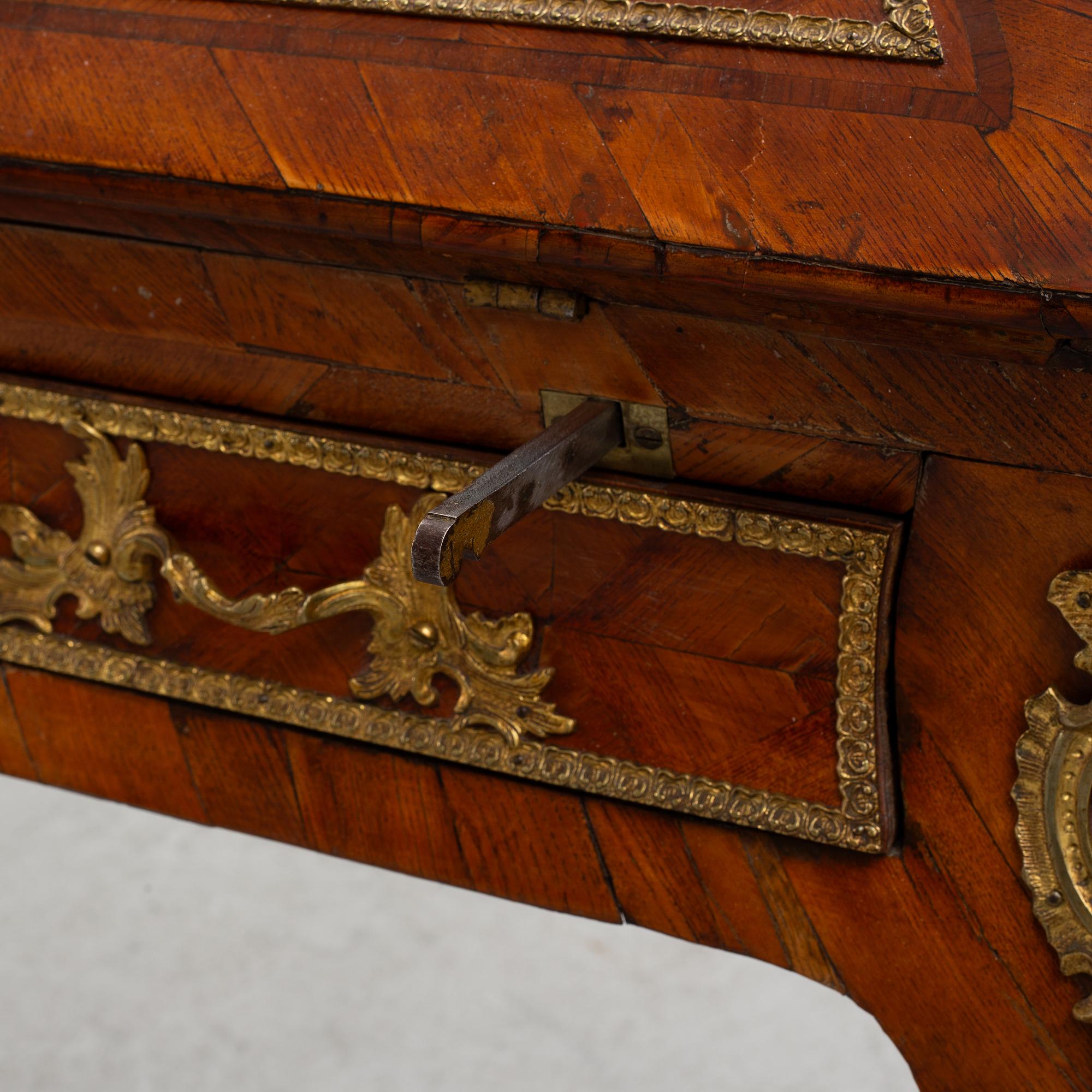 A rococo rosewood parquetry and gilt-brass mounted secretaire by J. H. Reimers (master in Stockholm 1754-73).