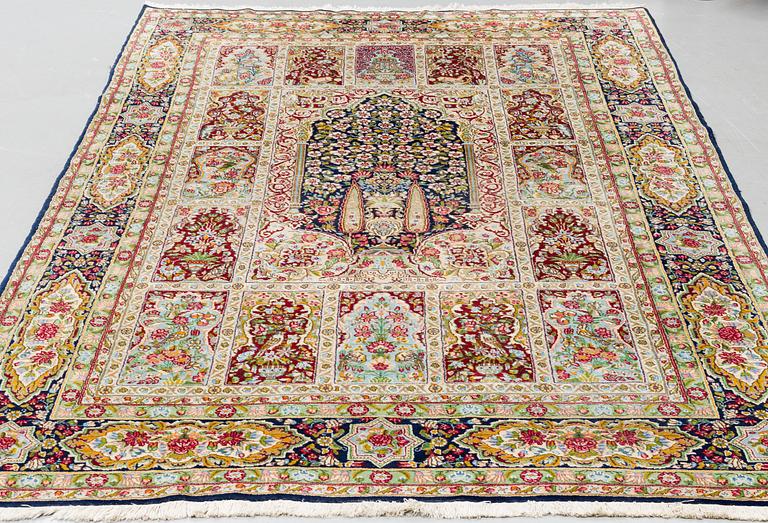 A CARPET, an old Kerman, ca 332,5-342 x 194-195,5 cm (as well as 1 cm flat weave at one end).