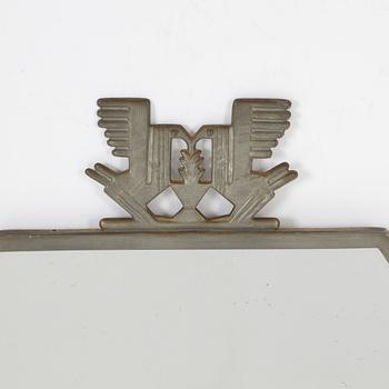 A Swedish pewter mirror, 1934.