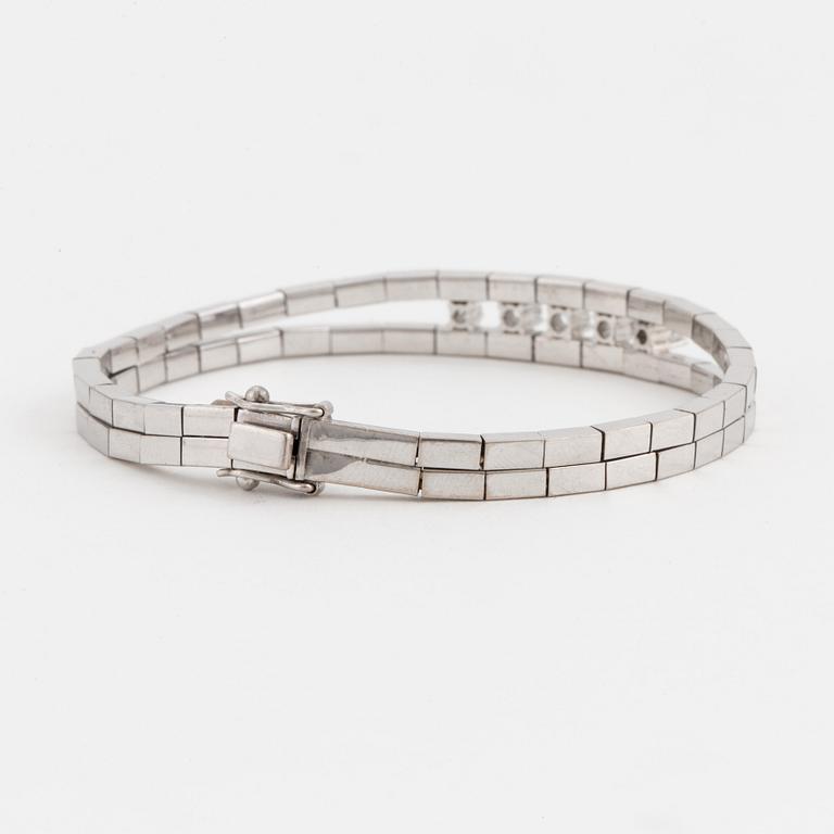 An Omega-link bracelet set with round, brilliant-cut diamonds.