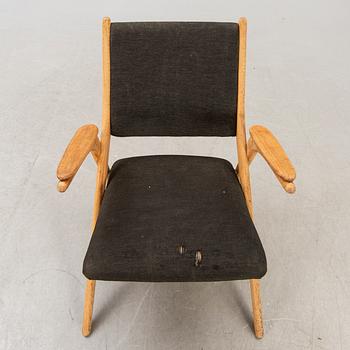 A Swedish oak and teak mid 1900s easy chair.