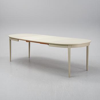 A dining table with two armchairs and six chairs by Carl Malmsten for Bodafors.