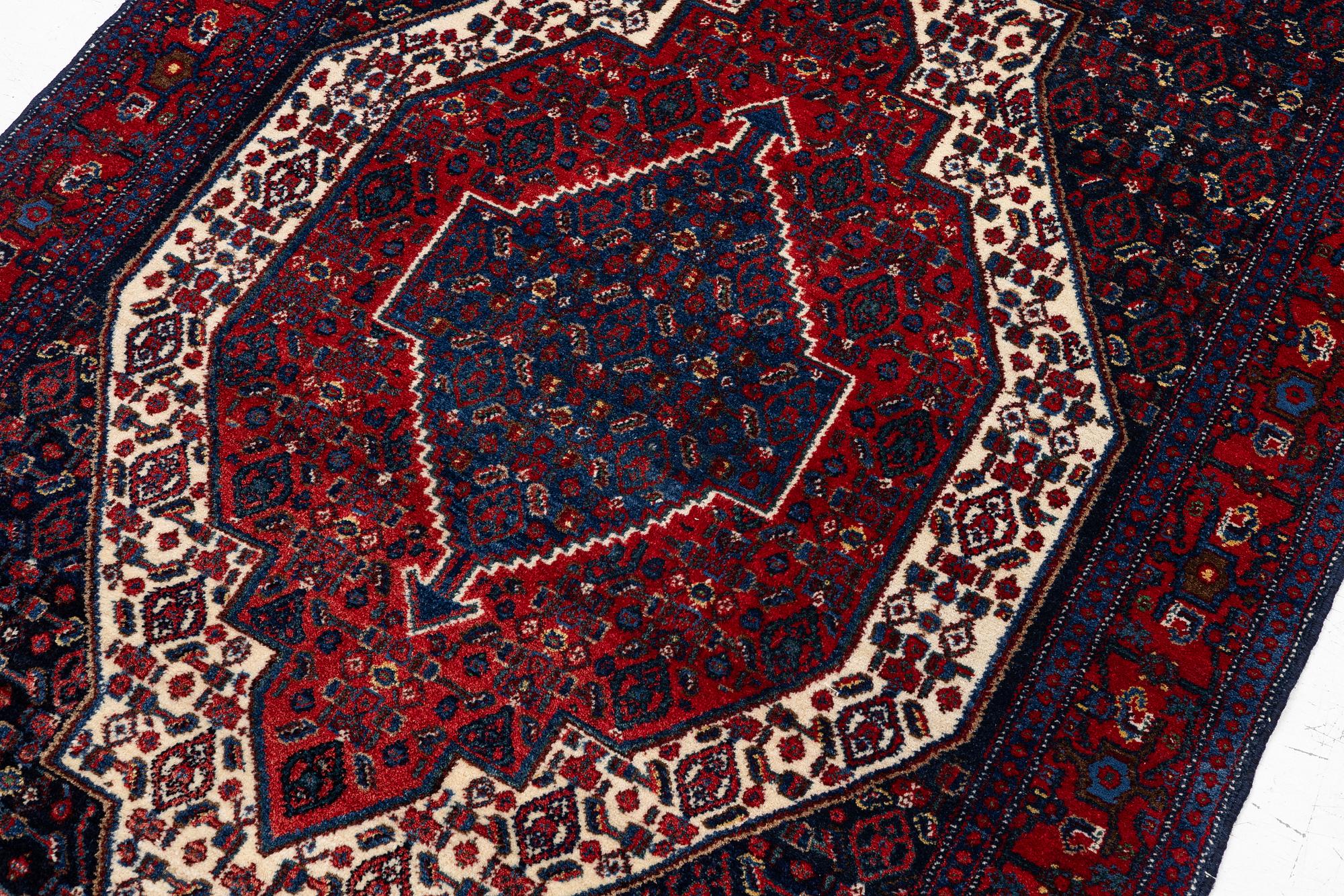 A Senneh rug, c. 160 x 117 cm.