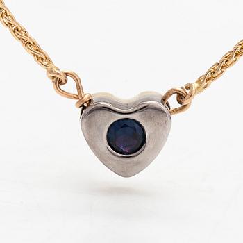 A 14K gold necklace, heartpendant with a sapphire and ruby. Finnish import marks.