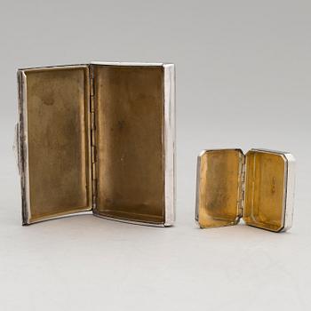 Three silver cigarette cases and a silver pillbox, marked in Finland and Germany, first half of the 20th Century.
