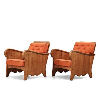 Axel Einar Hjorth, attributed, a pair of stained pine "Lovö" easy chairs, Nordiska Kompaniet, Sweden 1930's.