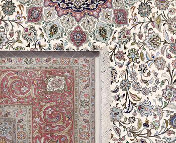 A part silk Tabriz carpet, 310 x 205 cm.