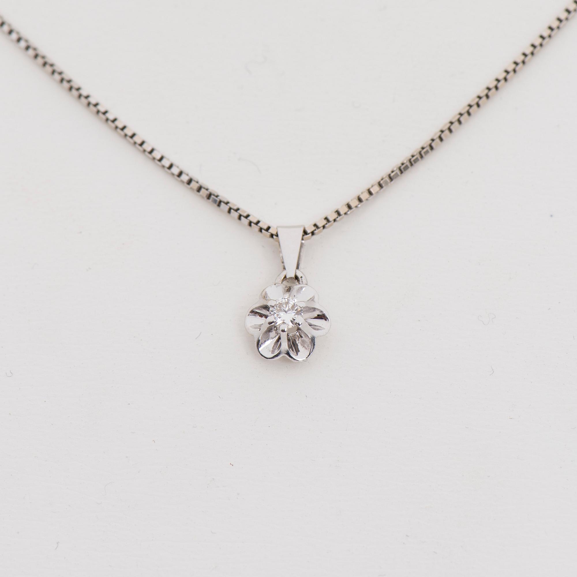 HÄNGE, 14K vitguld, briljantslipad diamant 0,10 ct. Vikt 3,8 g.